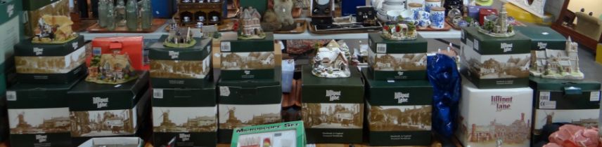 Four trays of sixteen Lilliput Lane model buildings to include: 'Strawberry Fields', 'The Joys of