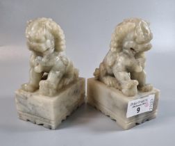 A pair of Chinese soapstone temple or foo dogs. 13cm high approx. (B.P. 21% + VAT)