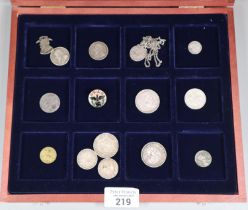 Group of assorted coins and tokens to include: Boer War, Prisoner of War One Shilling coin drilled