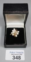9ct gold modernist design diamond and pearl ring. 3.2 g approx. Size N1/2. (B.P. 21% + VAT) No