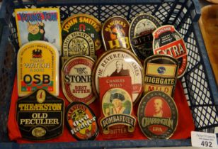 A small crate containing vintage advertising beer pump clips to include: 'Young Tom, Tomos Watkins &