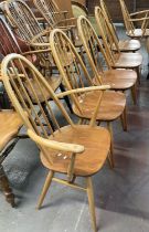 Set of six Ercol natural beech and ash hoop and spindle backed dining chairs, two open arm carvers