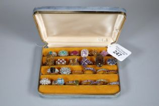 Ring box comprising an assortment of twenty five silver and other dress rings with coloured