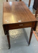 19th century mahogany Pembroke table on ring turned tapering legs and casters. (B.P. 21% + VAT)