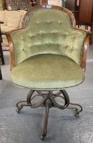 Unusual upholstered revolving tub chair with steel sprung base on casters. Probably French early