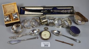 Bag of assorted silver and plated items to include: napkin rings, cream jug, flatware, pin