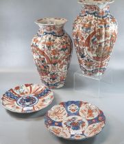 Pair of Japanese porcelain Imari vases of fluted baluster form together with two similar Japanese