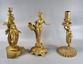 Gilded yellow metal figural candlestick together with a gilt metal figural candlestick and an Art