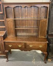20th century oak cabriole leg dresser having associated boarded rack back, two frieze drawers, on
