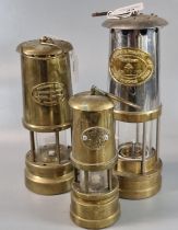 three unused Miner's safety lamps including: Thomas & Williams Ltd, Ferndale Coalmining Co. and