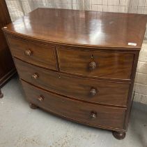 Small 19th century mahogany bow fronted chest of two short and two long cockbeaded drawers on bun