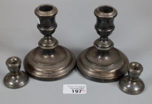 Pair of silver loaded dwarf candlesticks with Birmingham hallmarks together with a pair of miniature