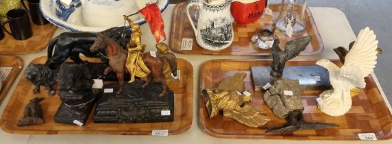 Two trays of animal figurines, various materials to include: eagles on plinths, male lions, gilded