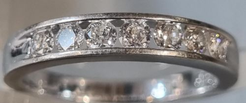 18ct white gold seven stone diamond eternity ring, marked 'forever'. 3.1g approx. Size I. (B.P.