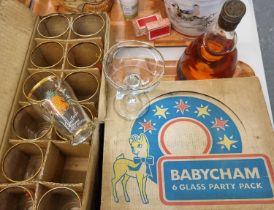 Bottles of Bols Creme De Mandarines, together with a cased set of six Babycham glasses and cased set