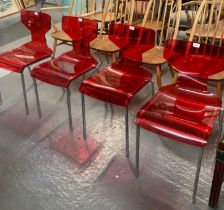 Set of four red perspex and chrome designer side chairs with impressed trade mark initials 'M B'. (