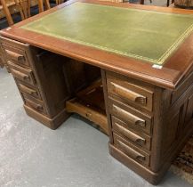 Mid century oak pedestal desk with associated hardwood top having inset leather writing surface.