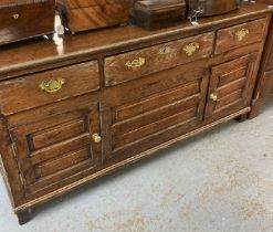 18th century oak dresser base with three moulded frieze drawers over two raised and fielded panel