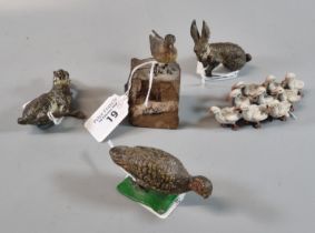 Group of cold painted bronze animal and bird figures, to include: duck on a rock, a gaggle of