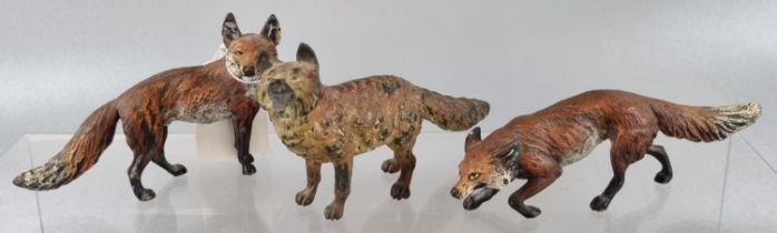 Group of three cold painted bronze foxes, various poses. Un-marked. (3) (B.P. 21% + VAT)