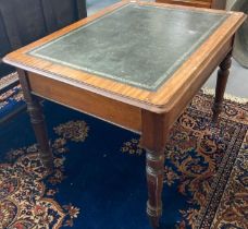 Edwardian mahogany writing table with inset leather top over three frieze drawers standing on