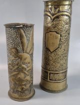 Trench Art - two similar embossed and worked brass shell cases, German decorated with the figure