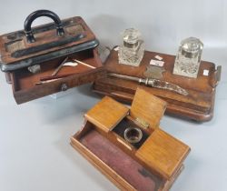 Two late Victorian desk inkwells, one with two glass inkwells and paper knife together with