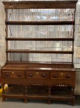 Early 19th century South Wales oak pot board dresser with open rack back, three frieze drawers