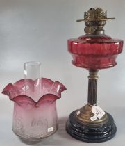 Early 20th century double oil burner lamp having cranberry and etched glass shade above a