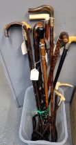 Collection of assorted walking sticks, canes and hunting crops with bone, horn and other handles,