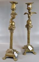 Pair of yellow metal Empire design Corinthian Column candle sticks with square bases having paw