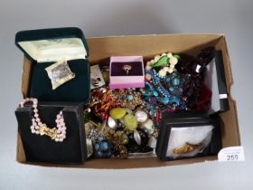 Box of assorted mainly costume jewellery: brooches, necklaces, chains and pendants, earrings etc. (