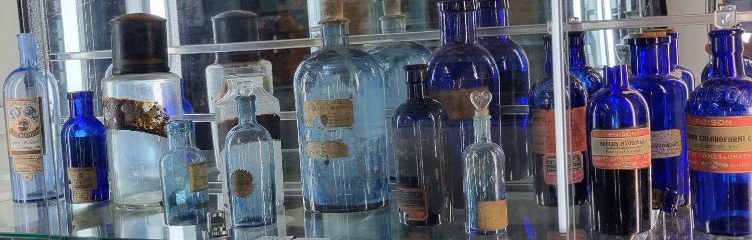 Collection of 19th century Bristol Blue glass and other apothecary jars/bottles, many with