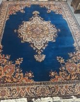 Large Middle Eastern design blue ground Axminster type carpet overall with foliate decoration.