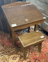 Early 20th century oak child's slope fronted school desk (44cm wide approx) together with solid