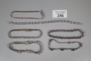 Collection of silver and clear and coloured stone bracelets. (B.P. 21% + VAT)