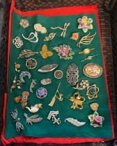 Collection of vintage and other brooches to include: anchor, owl, cat on broom, pineapple, snail