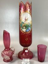 Three pieces of 19th Century cranberry glass to include: vase with porcelain panel of an exotic bird