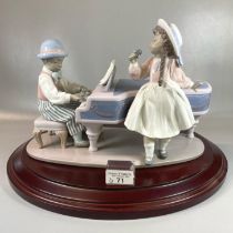 Lladro 5930 Spanish porcelain 'Jazz Duo' figure group on wooden base. With original box. (B.P. 21% +