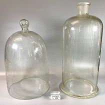 Two apothecary glass cloches. The tallest 38cm approx. (2) (B.P. 21% + VAT)