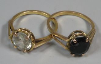Two yellow metal and coloured stone dress rings (purchased in Oman). 6g approx. Both size R. (2) (