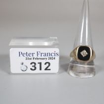 9ct gold ring inset with black hardstone and small diamond chip. 4.6g approx. Size S. (B.P. 21% +