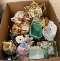 Box of china to include: fireside dog, novelty teapots , egg cruet sets, Cottage Ware items etc. (