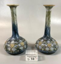 A pair of Royal Doulton stoneware specimen vases with tube lined heart and other decoration. 18cm