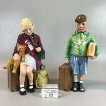 Two Royal Doulton bone china figurines; 'The boy evacuee' HN3202 and 'The girl evacuee' HN3203,