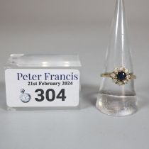 9ct gold clear and blue stone flower head ring. Size P. (B.P. 21% + VAT)