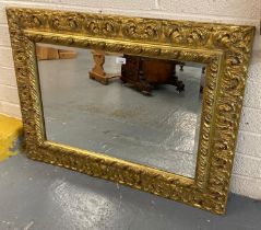 Modern gilt bevelled mirror, the frame with moulded foliate designs. 105x78cm approx. (B.P. 21% +