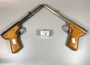 Two vintage Diana Model 2 air pistols, plated and black finished, both with wooden grips. (2) OVER