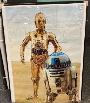 Two, believed to be original Star Wars posters: C3PO and R2D2 together with Chewbacca and other