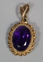 9ct gold pendant inset with purple faceted oval stone. 3.9g approx. (B.P. 21% + VAT)